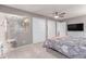 Primary bedroom with view of ensuite bathroom and walk in closets at 18434 E Belleview Ln, Centennial, CO 80015