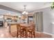 Bright dining area with hardwood floors, adjacent to the kitchen, and access to the backyard at 18434 E Belleview Ln, Centennial, CO 80015