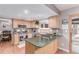 Kitchen boasts stainless appliances, tile countertops and backsplash, with bright, recessed lighting at 18434 E Belleview Ln, Centennial, CO 80015