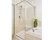 Close up of bright bathroom featuring a soaking tub and glass-enclosed shower at 1477 Serene Dr, Erie, CO 80516