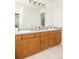 Bright bathroom featuring a double vanity with stylish countertops and vanity lighting at 1477 Serene Dr, Erie, CO 80516