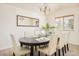 Dining room with ample seating and a contemporary chandelier at 1477 Serene Dr, Erie, CO 80516
