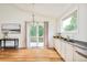 Kitchen area with adjacent outdoor deck and ample storage space at 1477 Serene Dr, Erie, CO 80516