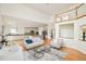Open concept living room and kitchen featuring a view of the second-story landing at 1477 Serene Dr, Erie, CO 80516