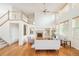 Bright living room boasts soaring ceilings, hardwood floors, a fireplace, and built-in shelving at 1477 Serene Dr, Erie, CO 80516