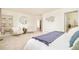 Spacious main bedroom with sitting area, ensuite bathroom, and natural light at 1477 Serene Dr, Erie, CO 80516