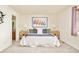Serene main bedroom with carpet, ensuite bathroom, and natural light at 1477 Serene Dr, Erie, CO 80516