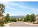A street view of the neighborhood features snow-capped mountains in the distance at 1477 Serene Dr, Erie, CO 80516