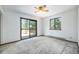 Bright bedroom with large windows and sliding door at 9530 Aspen Ln, Conifer, CO 80433