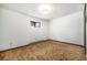 Neutral bedroom with carpet and a window at 9530 Aspen Ln, Conifer, CO 80433