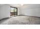 Bright bedroom featuring a sliding glass door leading to the outdoor balcony at 9530 Aspen Ln, Conifer, CO 80433
