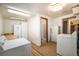Bright laundry room with a washer and dryer, cabinets, and a shower at 9530 Aspen Ln, Conifer, CO 80433
