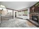 Comfortable living room with fireplace, and abundant natural light at 9530 Aspen Ln, Conifer, CO 80433