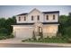 Charming two-story home with a two-car garage, inviting front porch and manicured landscaping at 2145 S Ider Way, Aurora, CO 80018