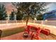 Outdoor patio area with lawn, planter boxes and string lights creating a cozy backyard retreat at 12411 Irving Dr, Broomfield, CO 80020