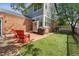 Cozy backyard featuring a patio, artificial turf, and a charming seating area perfect for outdoor entertaining at 12411 Irving Dr, Broomfield, CO 80020