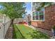 Spacious backyard features an artificial lawn, patio, and privacy fence, creating an ideal outdoor retreat at 12411 Irving Dr, Broomfield, CO 80020