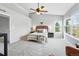 Comfortable bedroom with a ceiling fan and bright windows offering scenic views, creating a relaxing atmosphere at 12411 Irving Dr, Broomfield, CO 80020