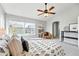 Cozy bedroom with a large window and neutral color palette, providing a serene and inviting space at 12411 Irving Dr, Broomfield, CO 80020