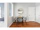 Cozy dining area with hardwood floors, a round table, and stylish seating at 12411 Irving Dr, Broomfield, CO 80020