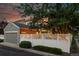 House exterior with brick accents, attached garage, fenced yard, and well-manicured landscaping at 12411 Irving Dr, Broomfield, CO 80020