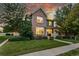 Beautiful two-story home with a well-maintained lawn, mature trees, and inviting curb appeal at 12411 Irving Dr, Broomfield, CO 80020