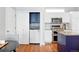Kitchen with laundry area, stainless steel appliances, and a center island at 12411 Irving Dr, Broomfield, CO 80020