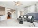 Bright and airy living room open to the kitchen featuring modern finishes and staircase at 12411 Irving Dr, Broomfield, CO 80020