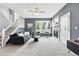 Bright living room with plush carpeting, modern fireplace, and ample natural light at 12411 Irving Dr, Broomfield, CO 80020