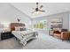 Spacious main bedroom with vaulted ceilings, large windows, and stylish decor at 12411 Irving Dr, Broomfield, CO 80020