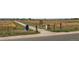 Community walking path featuring convenient trash and recycling receptacles, mail collection box, and community message board at 12411 Irving Dr, Broomfield, CO 80020
