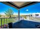 Relaxing covered porch offers stunning views of the expansive backyard and open landscape at 59466 E Commanche Way, Strasburg, CO 80136