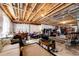 Spacious unfinished basement offering customization, exposed ceiling, and ample storage space at 59466 E Commanche Way, Strasburg, CO 80136