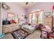Charming bedroom with playful decor, natural light, and whimsical touches at 59466 E Commanche Way, Strasburg, CO 80136