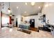 Bright, modern kitchen with stainless steel appliances, center island, and stylish countertops at 59466 E Commanche Way, Strasburg, CO 80136