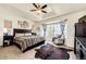 Spacious main bedroom with a tray ceiling, large windows, and a cozy sitting area, creating a relaxing retreat at 59466 E Commanche Way, Strasburg, CO 80136
