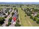 A high altitude view of the neighborhood with open space and Rocky Mountain views at 1376 Banner Cir, Erie, CO 80516