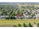Aerial view of a neighborhood with mature trees and green lawns, indicating a Gathering-friendly environment at 1376 Banner Cir, Erie, CO 80516