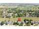 Aerial view showcases a neighborhood with a view of ponds and a green field at 1376 Banner Cir, Erie, CO 80516