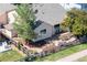 A view of the private backyard with lush landscaping and a concrete patio at 1376 Banner Cir, Erie, CO 80516