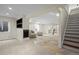 Spacious finished basement with carpet and tile, and a staircase leading to the upper level at 1376 Banner Cir, Erie, CO 80516