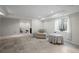 Finished basement with tiled floors, sitting area, and access to a separate workout area at 1376 Banner Cir, Erie, CO 80516