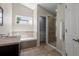 Bathroom features a soaking tub with tile surround, a separate shower, and a vanity with a sink at 1376 Banner Cir, Erie, CO 80516