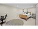 Finished basement with sleeping area including built-in cabinets and shelving at 1376 Banner Cir, Erie, CO 80516