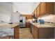 Gorgeous kitchen with oak cabinets, stone countertops, stainless steel appliances and tile flooring at 1376 Banner Cir, Erie, CO 80516