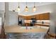 Updated kitchen featuring stone counters, stainless appliances, and pendant lighting at 1376 Banner Cir, Erie, CO 80516