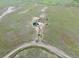 Aerial view of a single Gathering home in a rural setting, featuring a long drive way at 9 Timberlake Ct, Byers, CO 80103