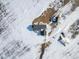 Aerial view of house on a large lot in snowy landscape at 9 Timberlake Ct, Byers, CO 80103