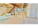 Unfinished basement with insulated walls, concrete floor, and exposed wood ceiling at 9 Timberlake Ct, Byers, CO 80103