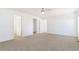 Large bedroom featuring neutral colors and multiple doorways at 9 Timberlake Ct, Byers, CO 80103
